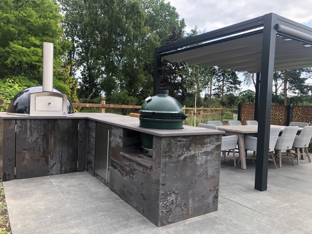 outdoor kitchen with pizza oven and smoker