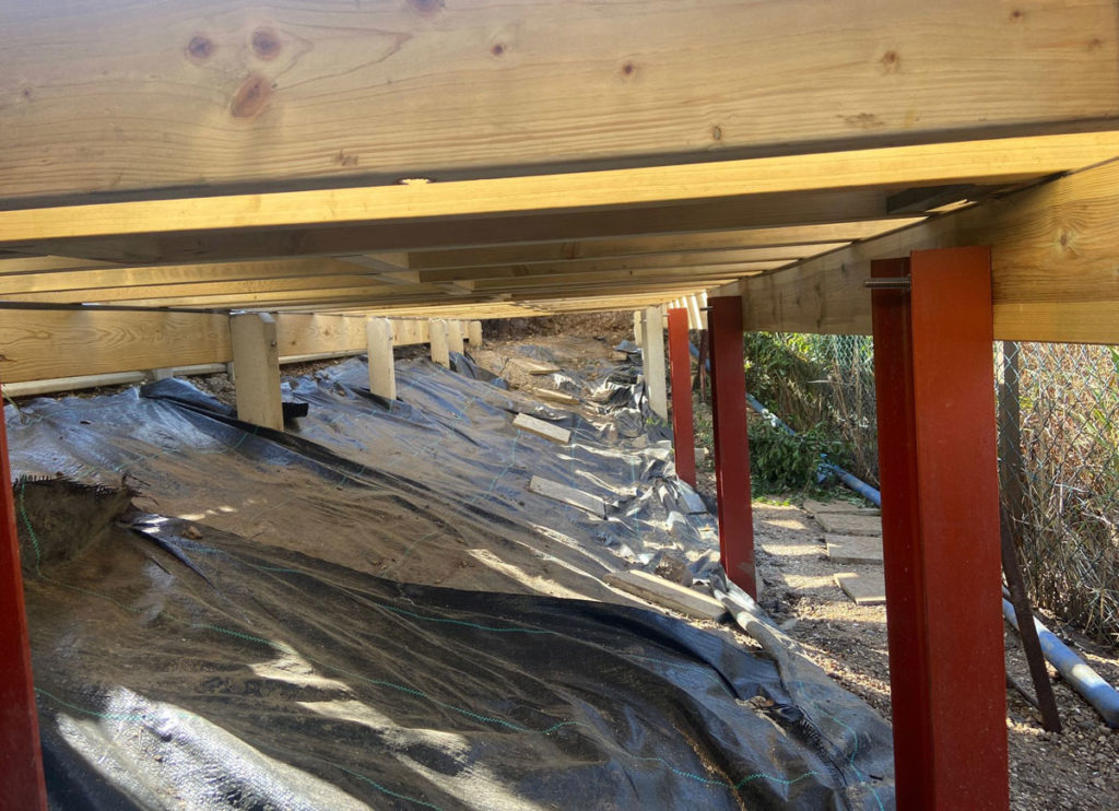 underside of decking project with steel support legs