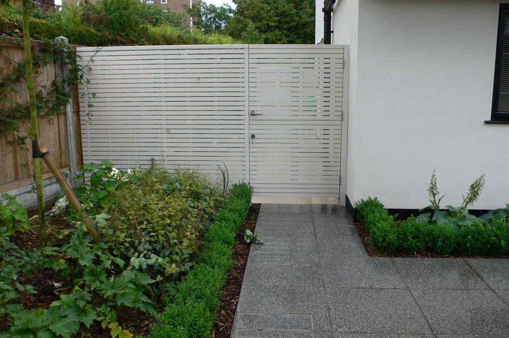 fence and gate with horizontal slats painted white