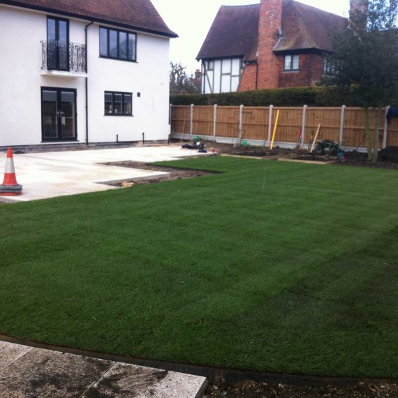 landscaped garden with new turf and patio