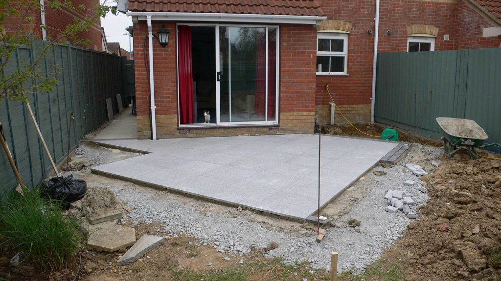 small diamond shaped patio laid at 45 degrees to the house