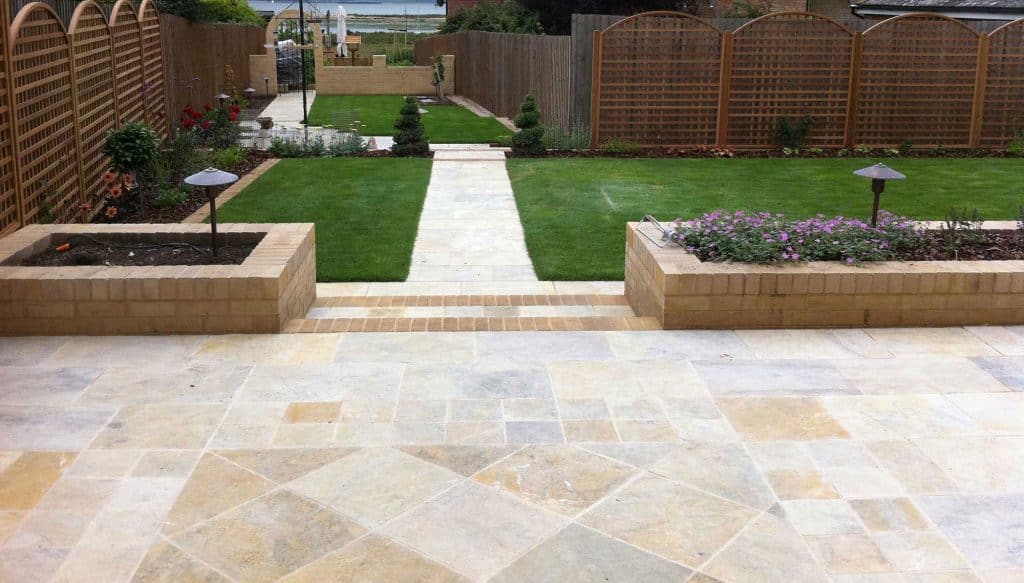 ideas for patios should always include the laying pattern. This patio has an interesting arrangement of slabs as well as views across Mersea Island in Essex