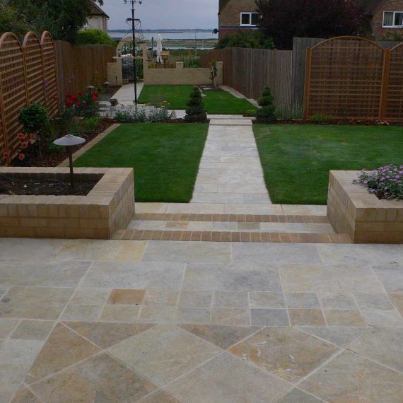 large patio with interesting laying pattern leading to views across Mersea Island in Essex