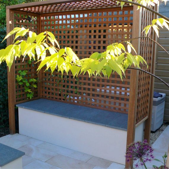 arbour seat with trellised sides and porcelain paved floor