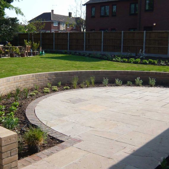 back garden with new semi circular patio and freshly turfed lawn