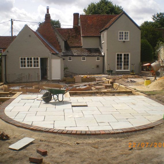 making a curved edge patio with sandstone slabs