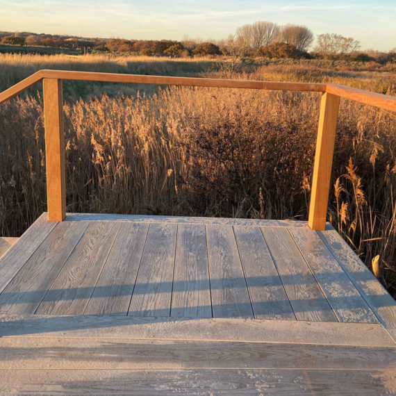 view point over the marshes from composite deck with timber handrail