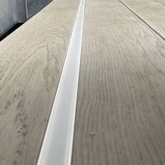 lighting strip running between composite decking boards