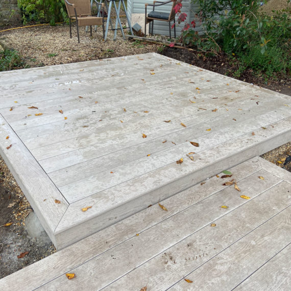 pale grey millboard composite decking forming a square shaped deck