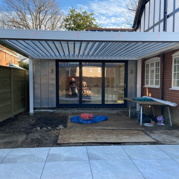 modern pergola adjoining kitchen extension to create extra living space