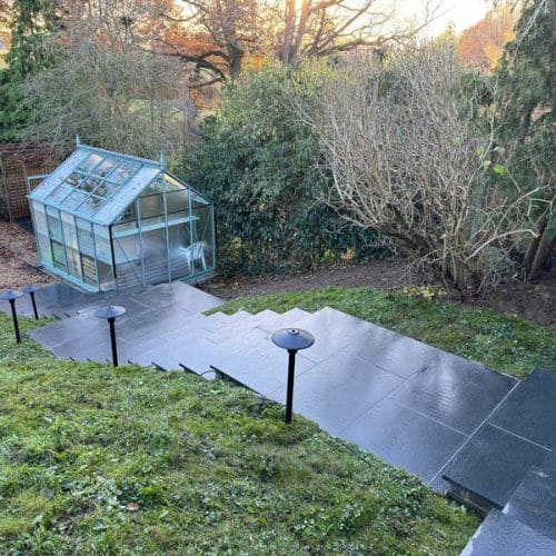Long flight of garden stairs with young wildflower meadow on the banks at either side