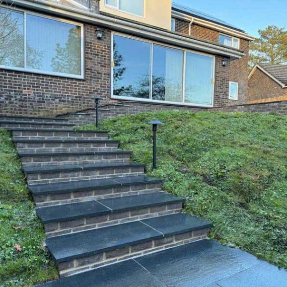 Garden stairs with black granite steps