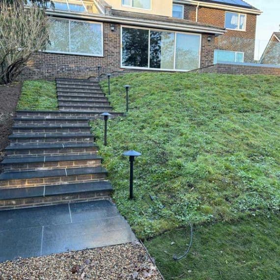 two flights of garden stairs making a steeply sloping bank more accessible
